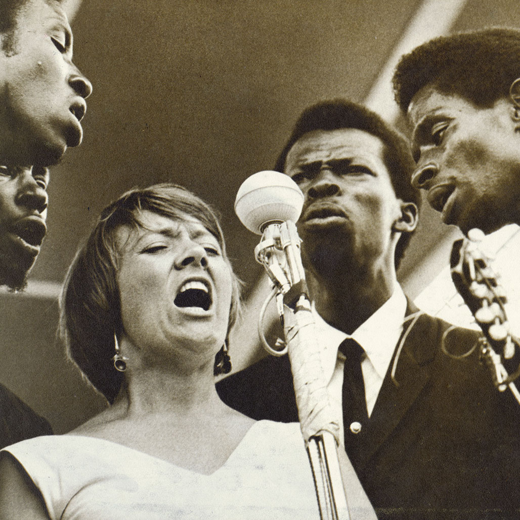 The Chambers Brothers perform with Barbara Dane at the 1965 Newport Folk Festival. Photo by Diana Davies.